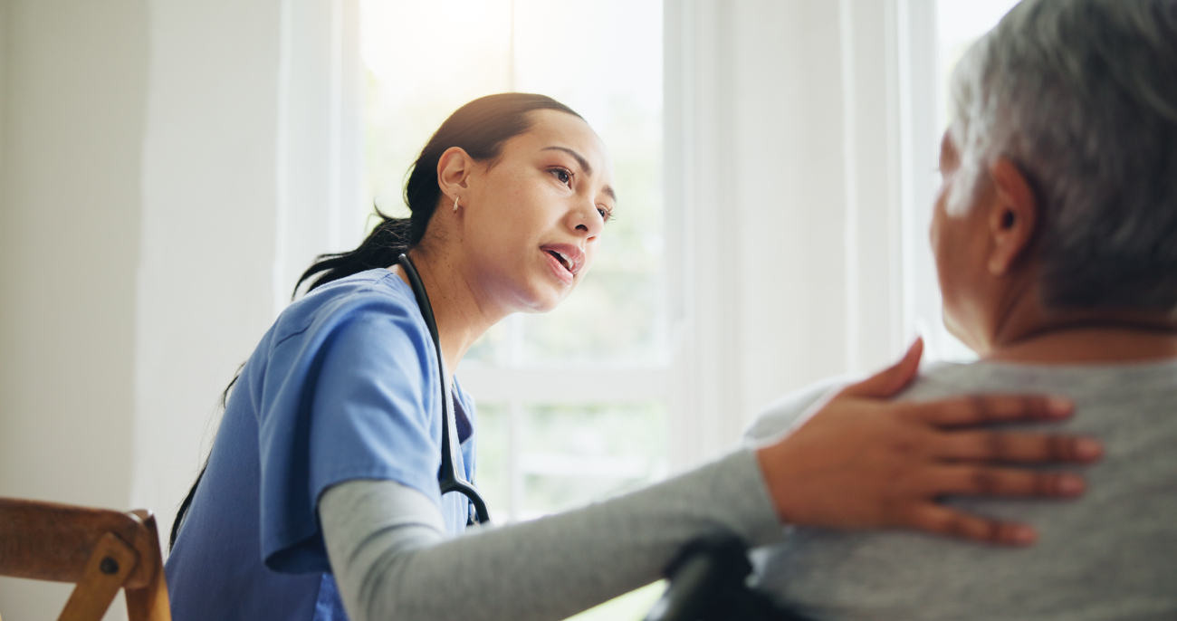 An older woman consulting with a doctor, looking relieved and confident.